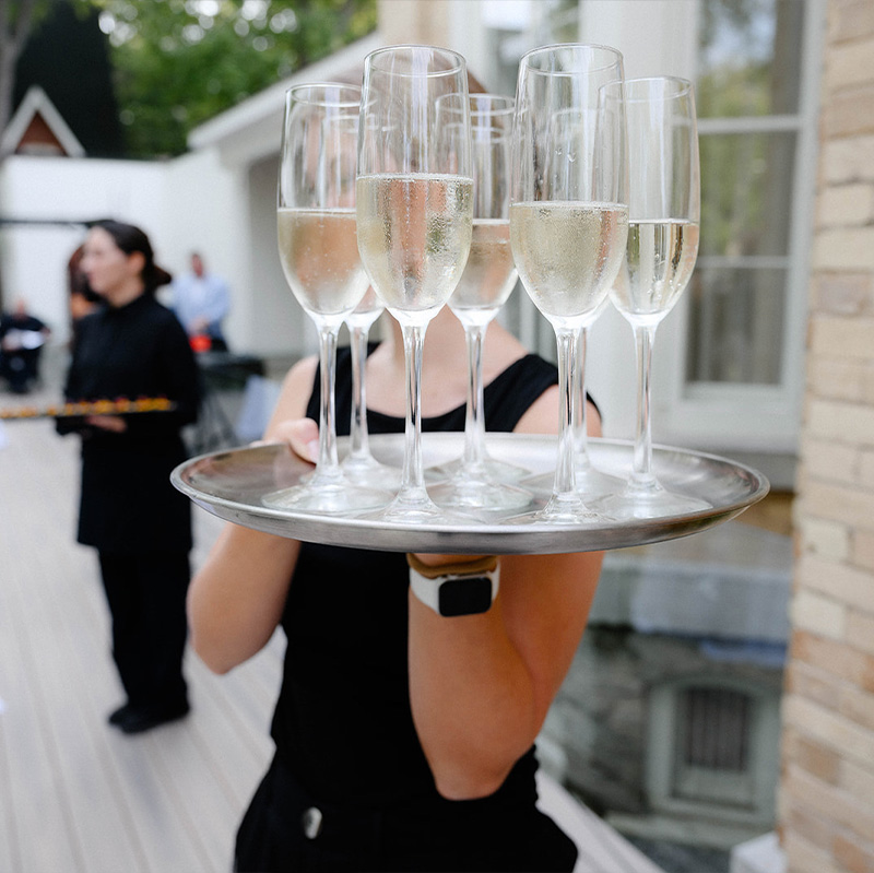 hawley-crescent-staff-delivering-a-tray-of-champagne