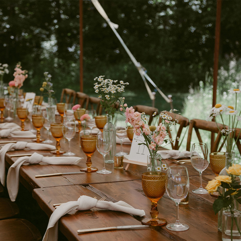 beautiful-wooden-table-and-chairs-set-up-for-an-event