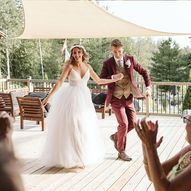 bride-and-groom-entering-their-beautifully-managed-wedding-event
