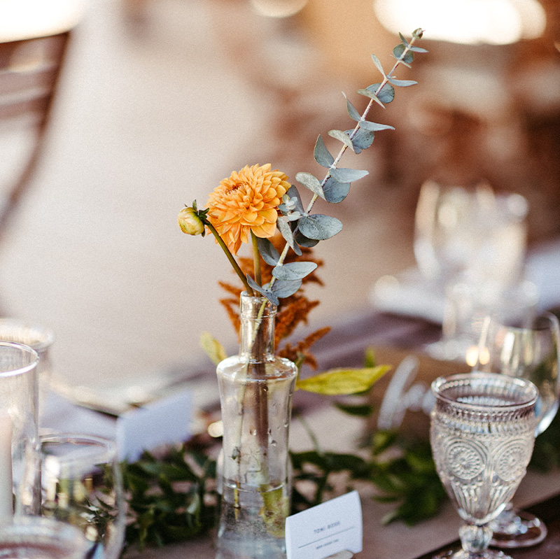 wedding-table-setting-with-clear-glass-and-eucalyptus-decorations